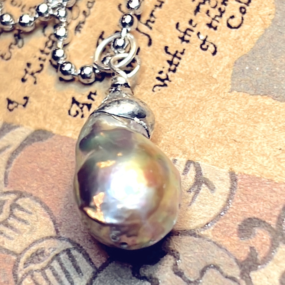 Beautiful Natural Pearl on daintiest 24” ballchain. This necklace sparkles!
